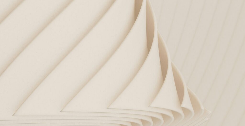 Abstrakte Darstellung von leicht aufgerollten Papierseiten.